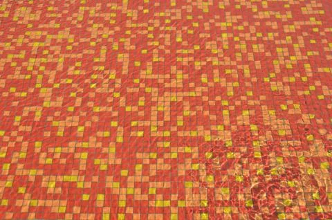 Paving red-yellow tile in the pool Stock Photos
