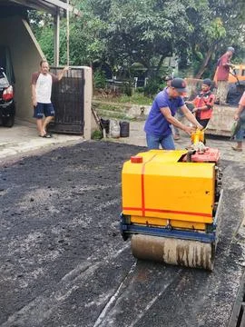 Paving a road in a residential complex Stock Photos
