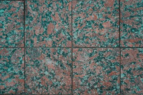The paving slabs are square in shape. Square paving slabs Stock Photos