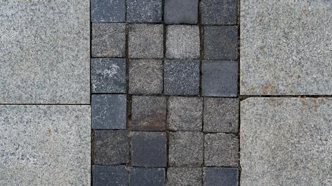 The paving slabs are square in shape. Square paving slabs Stock Photos