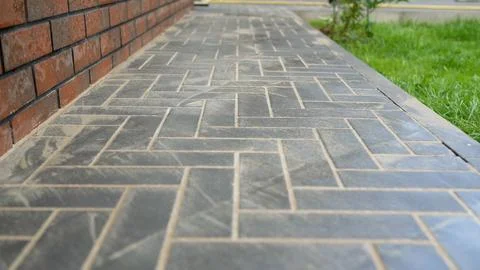Paving slabs forming a herringbone pattern walkway Stock Photos