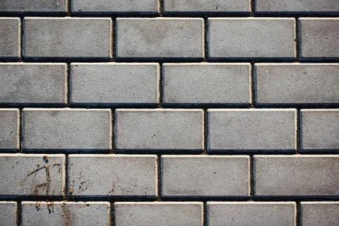 Paving slabs of rectangular brick. Texture of concrete blocks Stock Photos