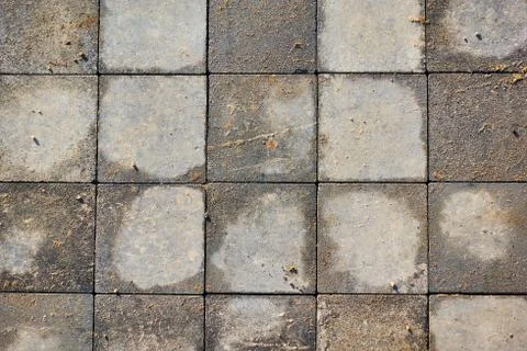 Paving slabs of square brick. Texture of concrete blocks Stock Photos