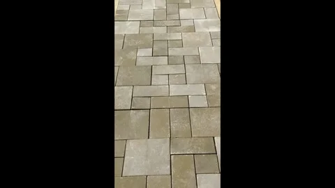 Paving stones arranged in a pattern showing different shades in a residential ar Stock Footage 327101356
