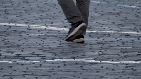 Paving stones on the square on which people are walking. Stockbeeldmateriaal 158302516