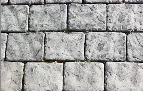 Paving stones, texture background old stones, gray large bricks, on the street Stock Photos