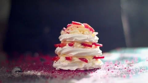 Pavlov's dessert on the table. Slowmo Stock Footage 137318351