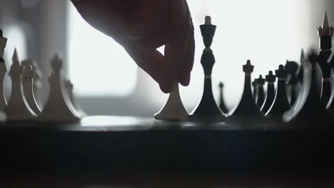 A pawn knocks down a Queen on a chessboard Stock Footage 143427711