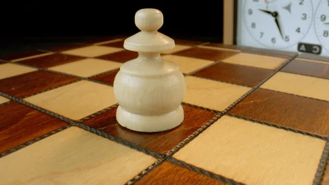 Pawn on rotating chess board Stock-Footage 112049349