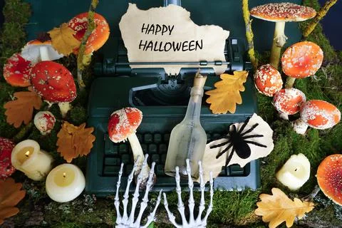 The paws of the skeleton are printed on a typewriter Stock Photos
