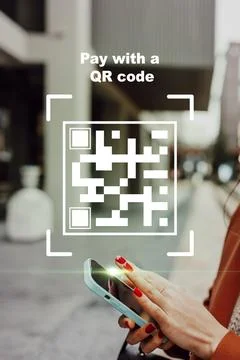 Pay for goods using a QR code on a smartphone in the city during the day Fotos de archivo