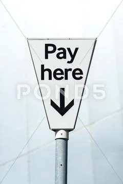 Pay Here sign in a Pay and display carpark Stock Photos