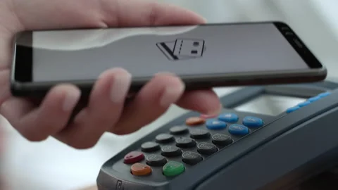 Pay by phone on electronic payment machine or card reader of mall. E-money at ca Stock Footage 199480664