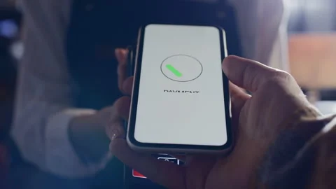 Pay by phone on electronic payment machine or card reader. E-money at cashless w Stock Footage 199480848