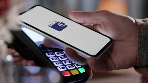 Pay by phone on electronic payment machine or card reader. E-money at cashless w Stock Footage 199480873