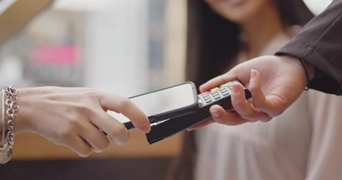 Pay by phone on electronic payment machine or card reader. E-money at cashless Stock Footage 201135128