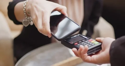 Pay by phone on electronic payment machine or card reader. E-money at cashless Stock Footage 201286787