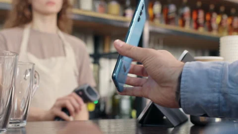 Pay by qr code on phone screen at coffee bar. Qr reader scans electronic card to Stock Footage 199485749
