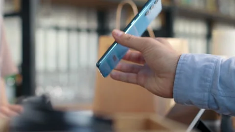 Pay by qr code on phone screen at coffee bar. Qr reader scans electronic card to Stock Footage 199485843