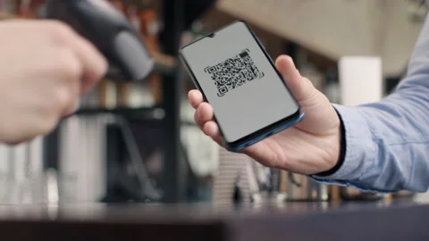 Pay by qr code on phone screen at coffee bar. Qr reader scans electronic card to Video stock 199485849