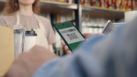 Pay by qr code on phone screen at coffee bar. Qr reader scans electronic card to Video stock 199485959