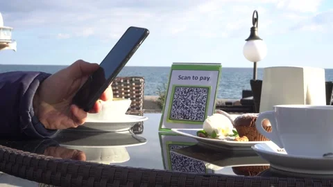 Pay touch-free with a QR code. QR code scanning app. Touchless digital payment Stock Footage 143897224