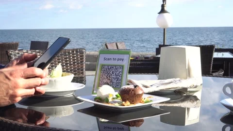 Pay touch-free with a QR code. QR code scanning app. Touchless digital payment Stock Footage 148535544