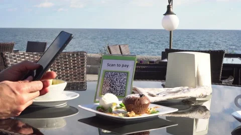 Pay touch-free with a QR code. QR code scanning app. Touchless digital payment Stock Footage 201455885