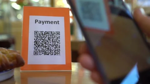 Pay touch-free with a QR code. QR code scanning app. Touchless digital payment Stock Footage 220690918