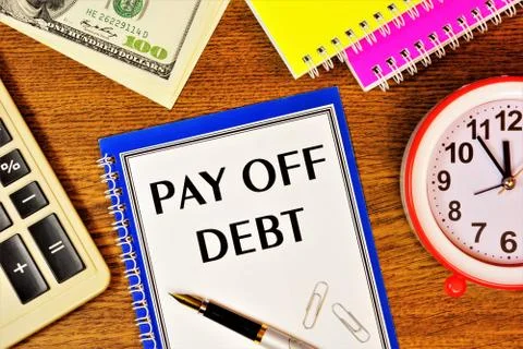 Pay off your debts-a text message on the business event planning form. Stock Photos