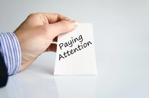 Paying attention text concept Stock Photos