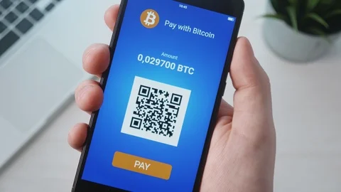 Paying with bitcoin using smartphone Stock Footage 88899991