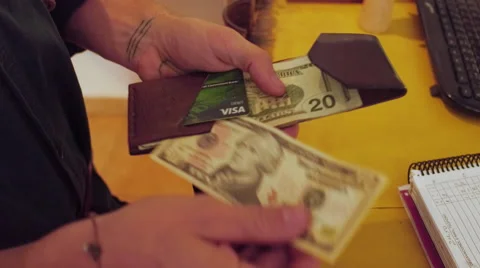 Paying with cash at a hostel Stock-Footage 67859592