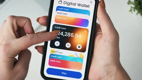 Paying with a credit card using digital wallet on the smartphone. Choosing from Stock Footage 243934685