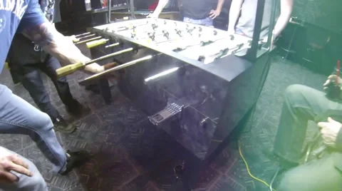 Paying of a game of Foosball Table soccer at a sports bar Stock Footage 45430352