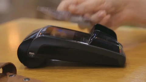 Paying by nfc card through the wireless terminal. Stock Footage 92366935