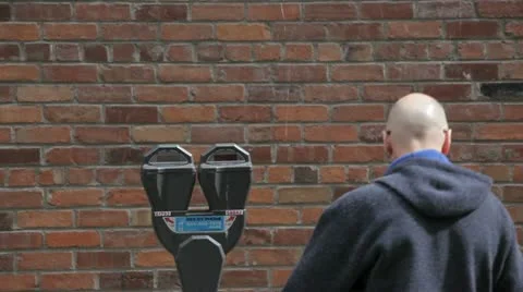 Paying a parking meter Stock Footage 10920892