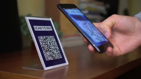 Paying with QR Code. Touch-Free QR Code Commerce. Display with a printed qr code Stock Footage 145112902