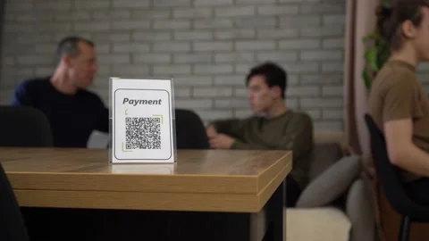 Paying with QR Code. Touch-Free QR Code Commerce. Display with a printed qr code Stock Footage 147704081
