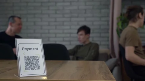 Paying with QR Code. Touch-Free QR Code Commerce. Display with a printed qr code Stock Footage 155851587