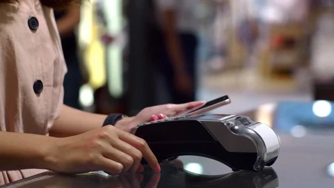 Paying with smartphone device wirelessly over credit card transaction Stock Footage 115064981