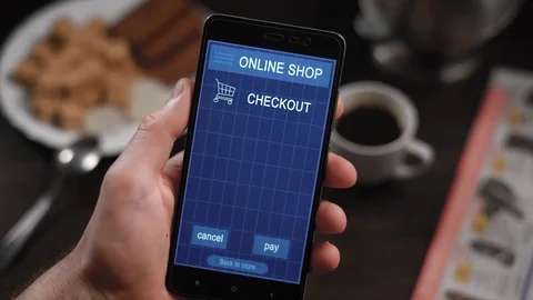 Paying a store receipe with a smartphone app. In the frame of man's hands Stock Footage