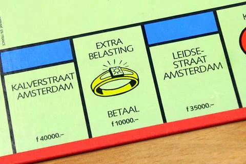 Paying taxes point on a Dutch Monopoly game board Stock Photos
