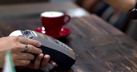 Paying through smart phone using NFC technology. Close-up. 4K modern technology Video stock 336585635