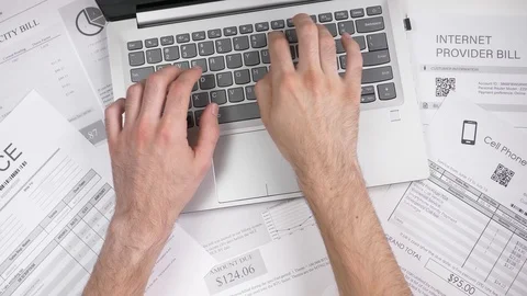 Paying Utilities Bills on a Laptop Computer Concept Stock Footage 99747606