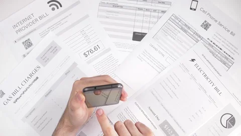 Paying Utilities Bills On Smartphone Device From Above Stock Footage