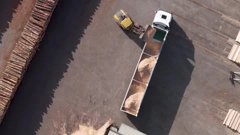 Payloader Loading Bulk Of Sawdust Into Trailer Truck At Wood Factory Video stock 265959299