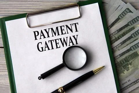 PAYMENT GATEWAY - words on a white sheet on the background of banknotes, ma.. Stock Photos