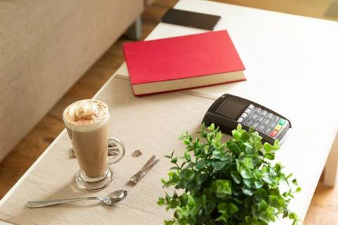 Payment machine on the table in cafe, nfc payment concept Stock Photos