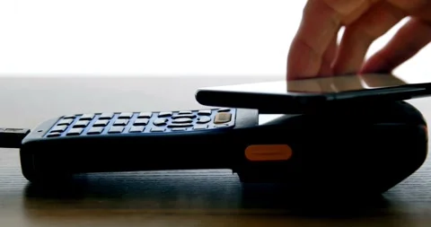 Payment made with smartphone using nfc system mobile phone on cash machine Stock-Footage 336585674